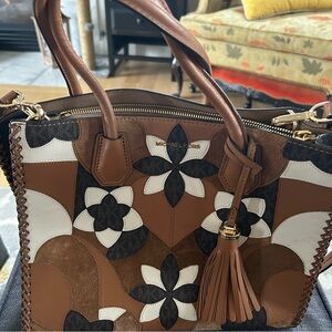 Michael Kors brown floral genuine leather purse.
